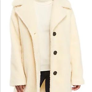 Big fuzzy cram colored shearling teddy bear coat.  Great condition.